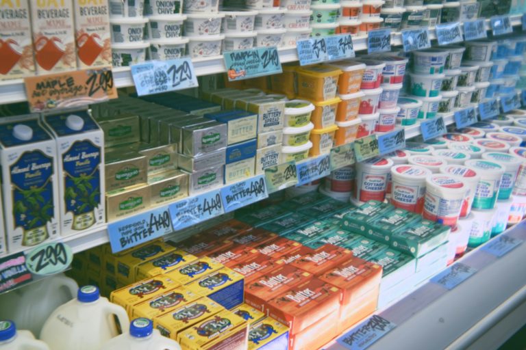 Inside an American grocery store with stocked refrigerated aisles